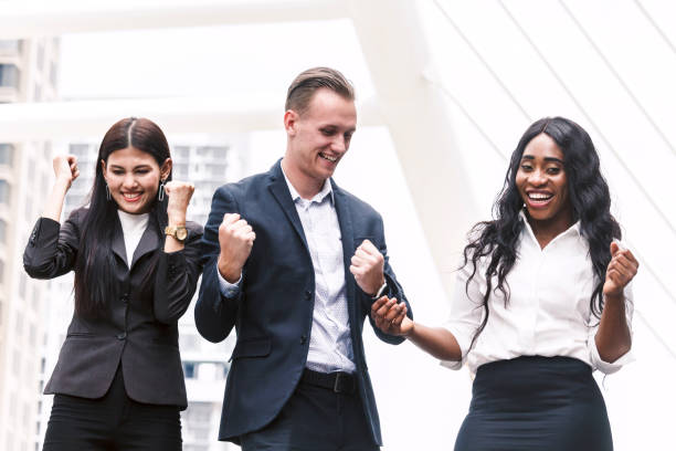 istock Successful business people celebrating with arms up 909463410