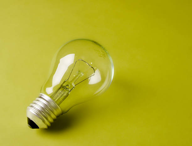 istock Light bulb laying on the geen background 90946604