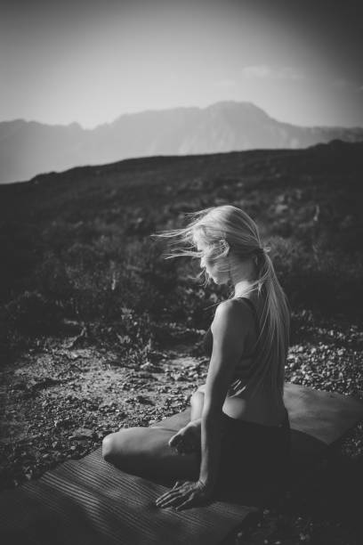 istock Female model practicing yoga in the outdoors doing stretching and exercising balance. 909472488