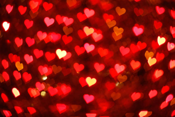 istock Blurring lights bokeh background of hearts 909474344