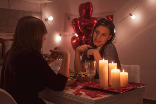 istock Lesbian couple celebrating Valentine's day 909478366