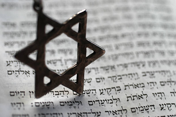 istock Star of David keychain on top of Old Testament book 90947883