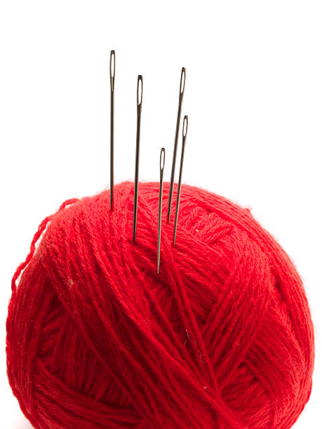 istock Many needles in a red yarn ball 90948275
