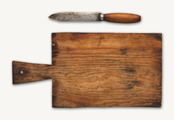 Old wooden cutting board isolated on white background. Closeup of textured rustic platter for cutting pizza, bread or meals serving, top view