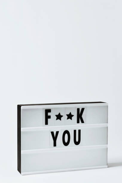 istock text f**k you in a lightbox 909485652