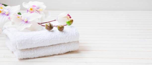 istock Spa still life with orchid flower and towels 909486064