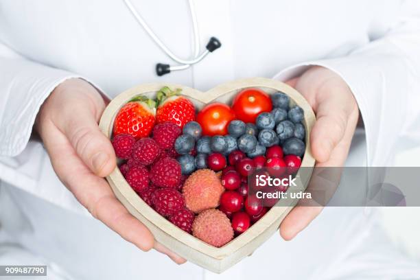 Doctor And Stethoscope With Heart Healthy Diet Food Abstract Medicine Concept Stock Photo - Download Image Now