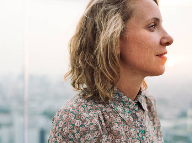istock Blond woman at a rooftop 909493522