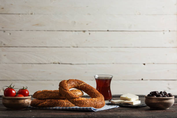 Turkish Simit Bagel on Rustic Table Delicious Turkish Simit Bagel on Rustic Table turkish bagel simit stock pictures, royalty-free photos & images