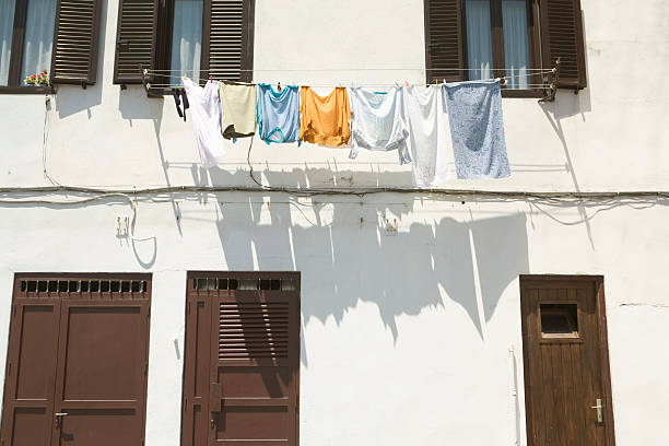 istock Clothes dry on a line hanging from an apartment 90949835