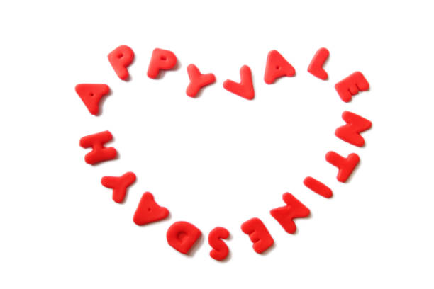 heart shaped, red colored happy valentine's day letters made off playdoh. 14 february.valentine's day background concept and holiday celebration.top view.copy space for text. - playdoh imagens e fotografias de stock