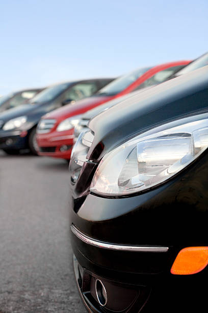 Front part of parked cars on a row stock photo