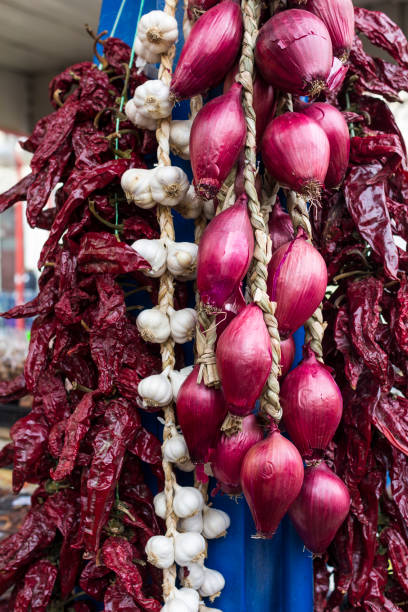 istock Onion and galic on the market place 909506570