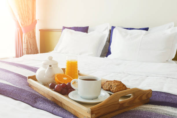 istock Breakfast served in bed on wooden tray 909509294