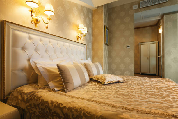 istock Interior of double bed hotel bedroom 909509504