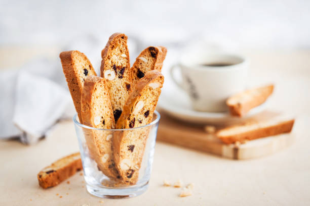 italian cranberry almond biscotti  and cup of coffee - biscotti imagens e fotografias de stock