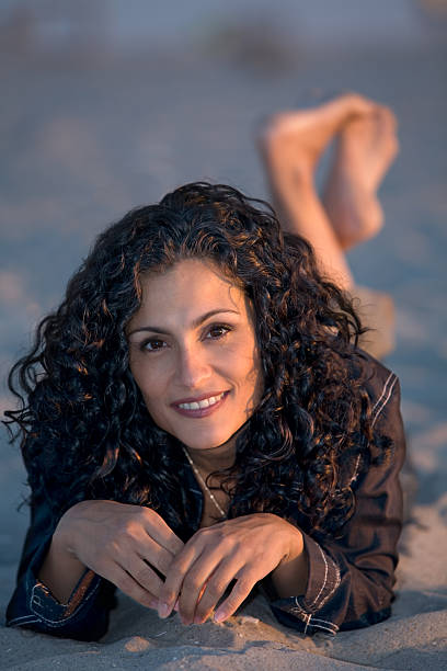 Hispanic girl on beach stock photo