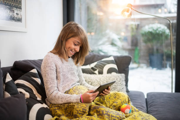 istock Young girl with digital tablet 909513760