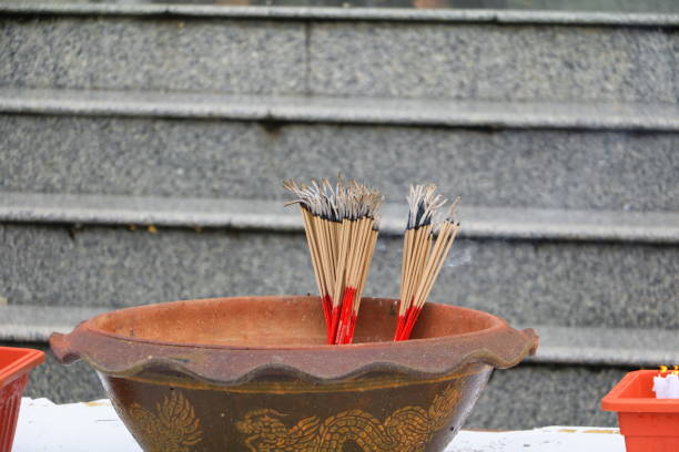 istock lncense stick burning and smoke in pot 909518898