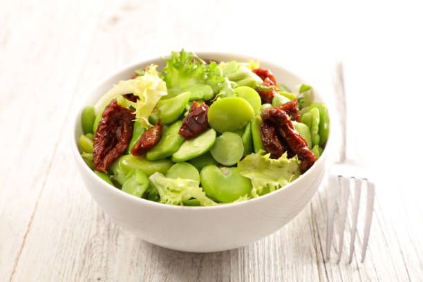 istock broad bean salad on wood background 909519502