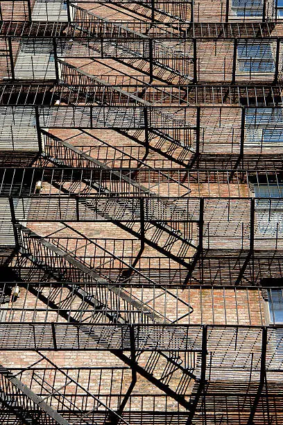 Photo of zig zagging fire escape on back of old apartment building