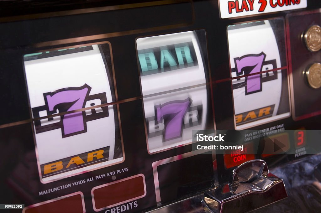 Lucky Sevens at the Slots  Slot Machine Stock Photo