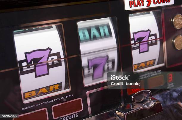 Lucky Sevens At The Slots Stock Photo - Download Image Now - Slot Machine, Machinery, Jackpot