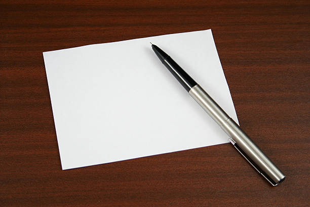 istock silver pen and  white sheet of paper 90952158