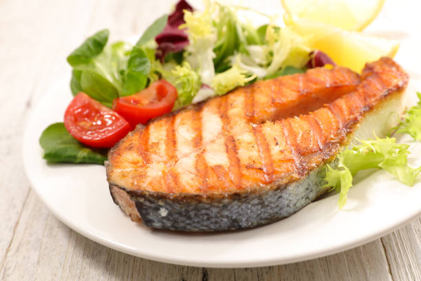 istock grilled salmon steak with salad 909523398