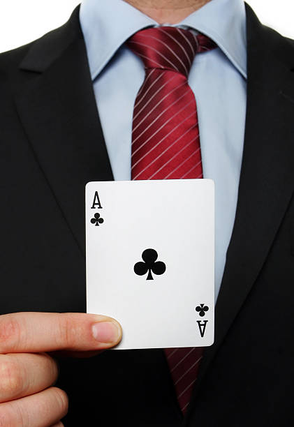 istock businessman holding an black flowers ace 90952525