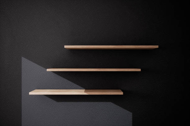 istock Wooden shelves on a dark wall. 3d rendering 909526124