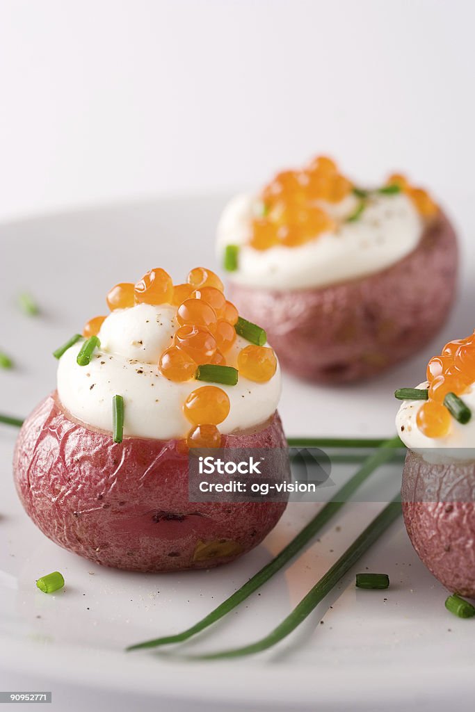 Potato with red caviar  Appetizer Stock Photo