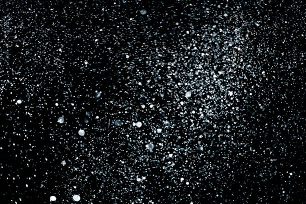 istock christmas silver sparkle glitter explosion dust particles background with bokeh, holiday happy new year and valentine day 909529388