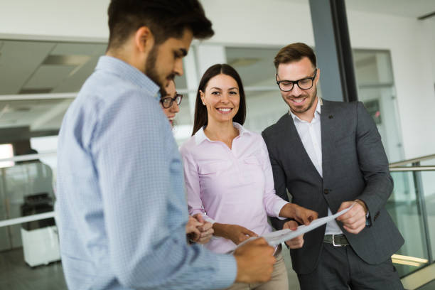 istock Happy colleagues casual chat at the office 909529668