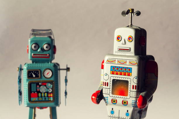 istock Two vintage tin toy robots, robotic delivery, artificial intelligence concept 909529786