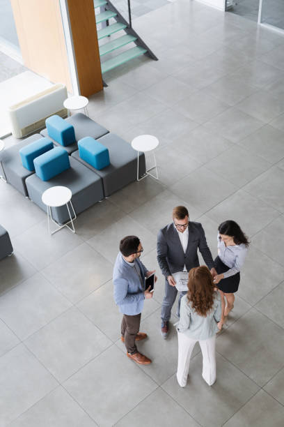 istock Group of business people collaborating and working on project 909530180