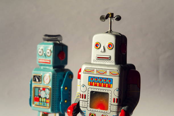 istock Two vintage tin toy robots, robotic delivery, artificial intelligence concept 909530204