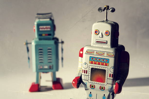 istock Two vintage tin toy robots, robotic delivery, artificial intelligence concept 909530632