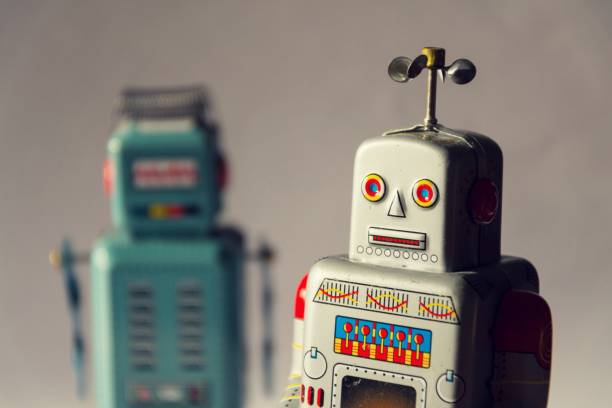 istock Two vintage tin toy robots, robotic delivery, artificial intelligence concept 909530898