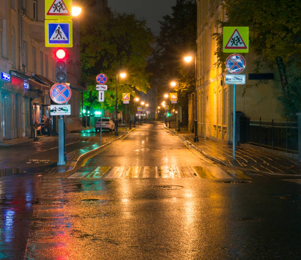 istock city street at rainy night. background 909530946