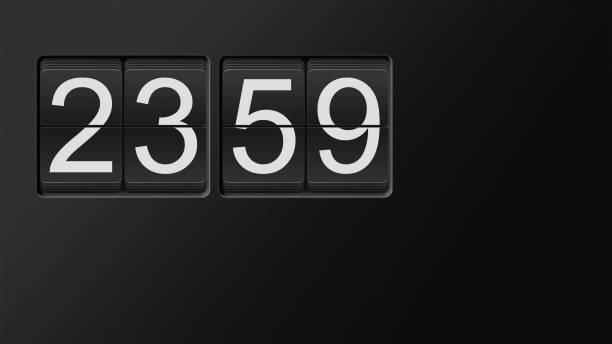 istock Classic flip clock watch face showing 23:59 with white numbers on black background 909538170