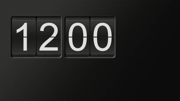 istock Classic flip clock watch face showing 12:00 with white numbers on black background 909538226