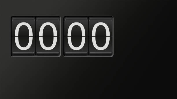 Classic flip clock watch face showing hour and minutes set to 00:00 with white numbers on black background; great copy space; nobody