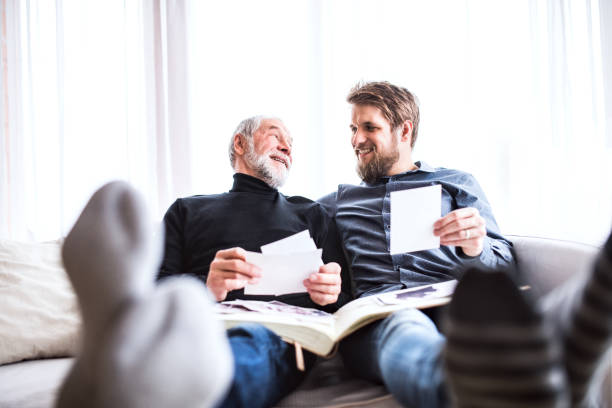 istock Hipster son and his senior father at home. 909538836