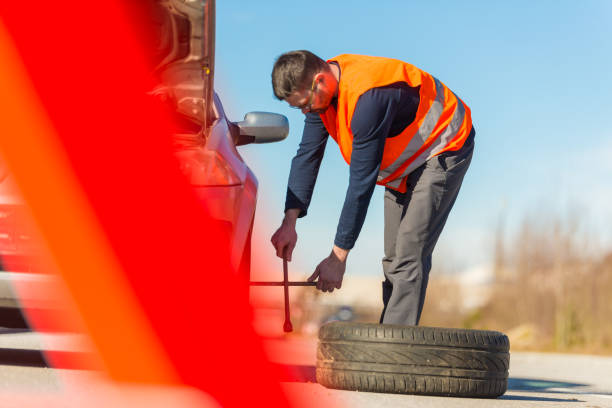 Problem with a car. A broken car on the road. Changing wheel stock photo