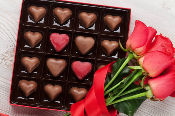 istock Valentines day with red roses and chocolate 909543136