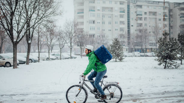 delivery boy on a bike - bicycle messenger imagens e fotografias de stock