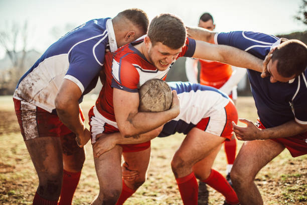 istock Tackling on a rugby field 909550642