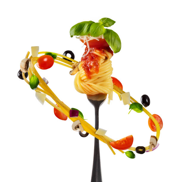 istock Flying italian pasta with vegetable and fork, isolated on white background 909554778