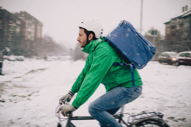 istock Delivery man on a bike 909558846